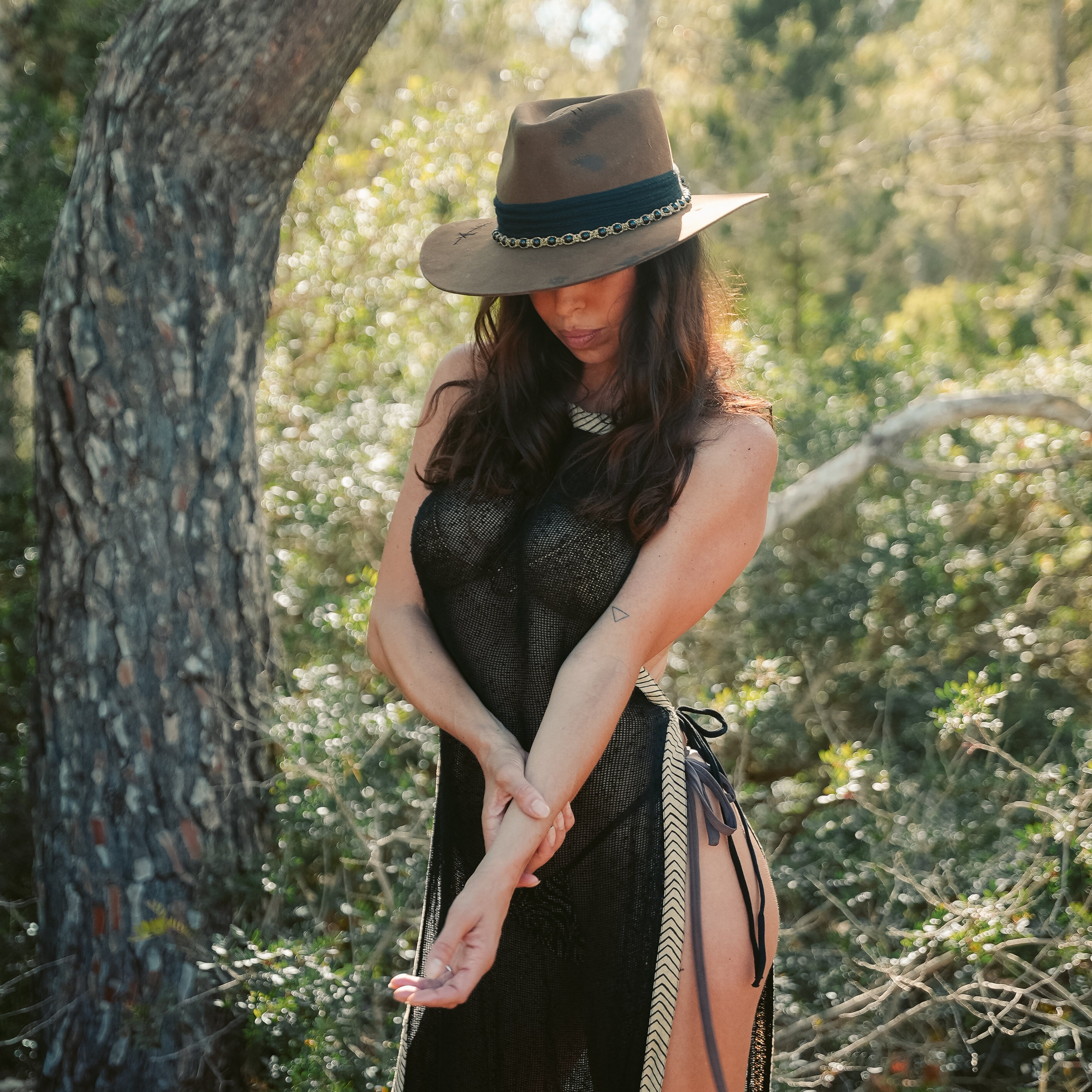 Fire-finished crown on handcrafted dark fedora with crystal bead detail — Satori Collection Untamed