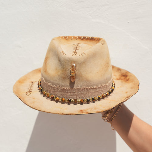 Close-up of Citrine and Tigers Eye crystals on handmade beige felt hat — Satori Collection