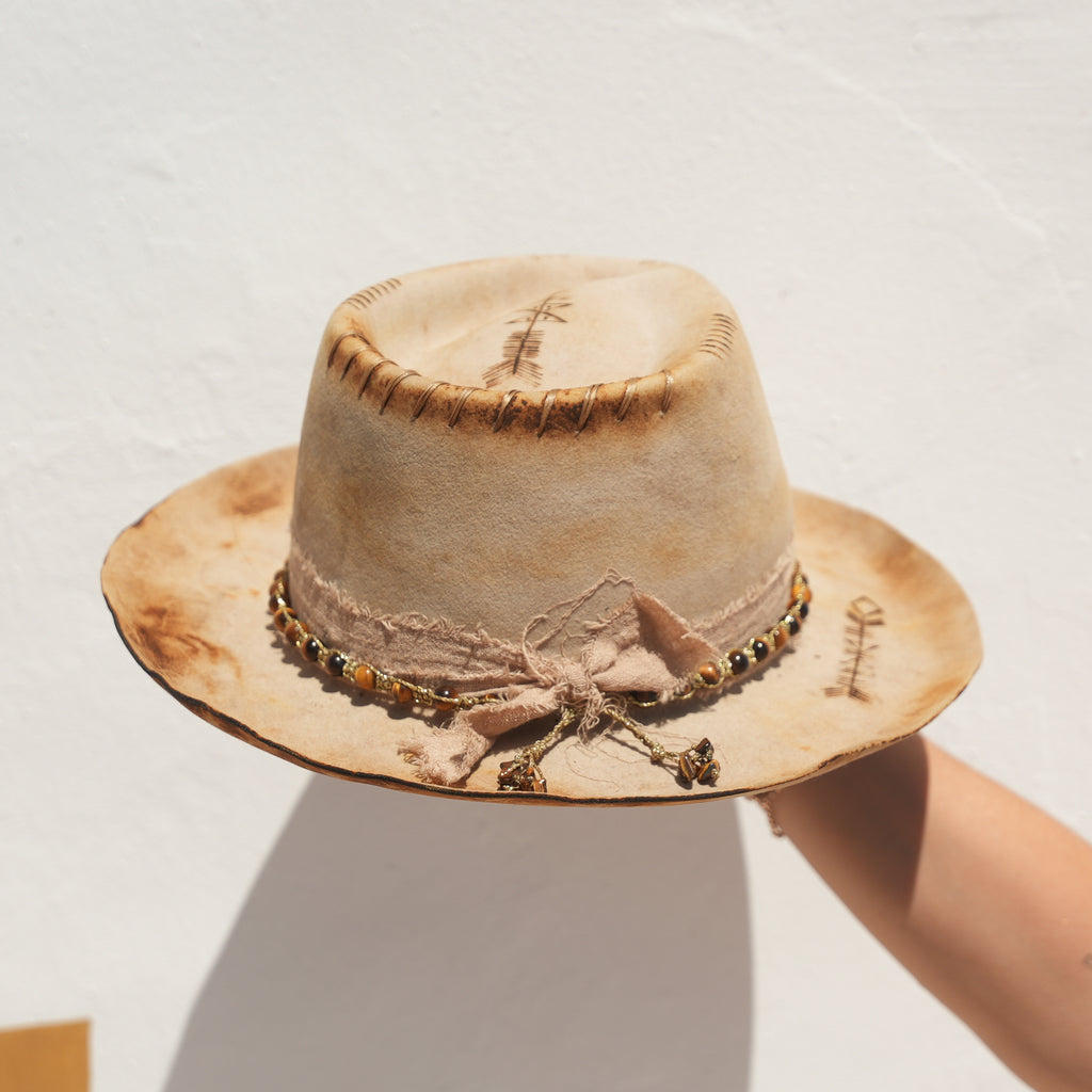 Fire-distressed crown and silk lining detail on handcrafted Satori hat — Abundance