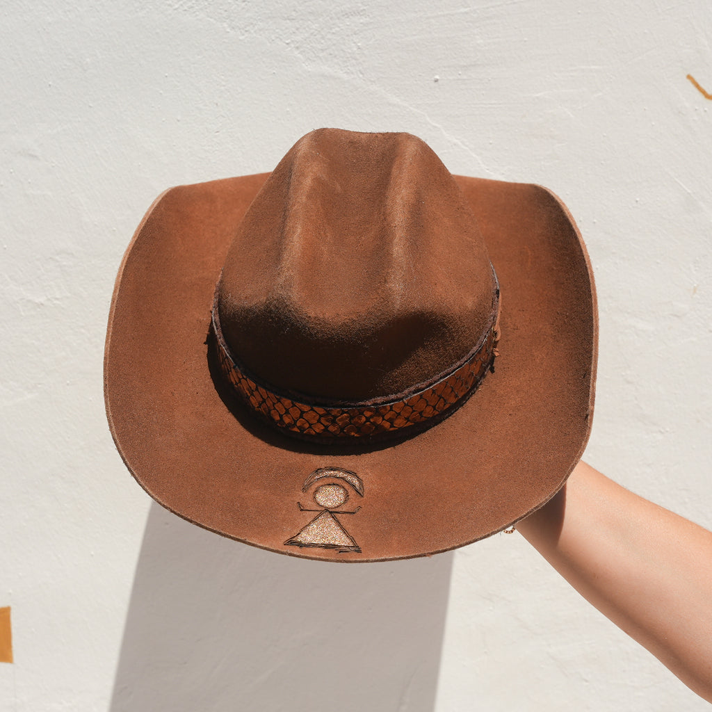 Close-up of Tanit-goddess engraved brim on handcrafted Merino wool felt hat — Satori Collection