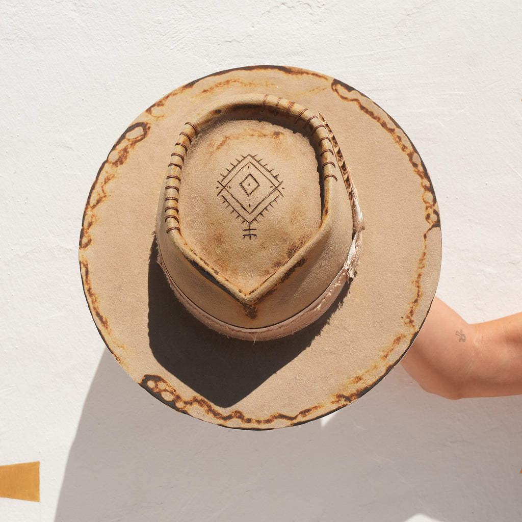 Fire-distressed crown detail on handcrafted beige felt fedora — Satori Collection Earth Side