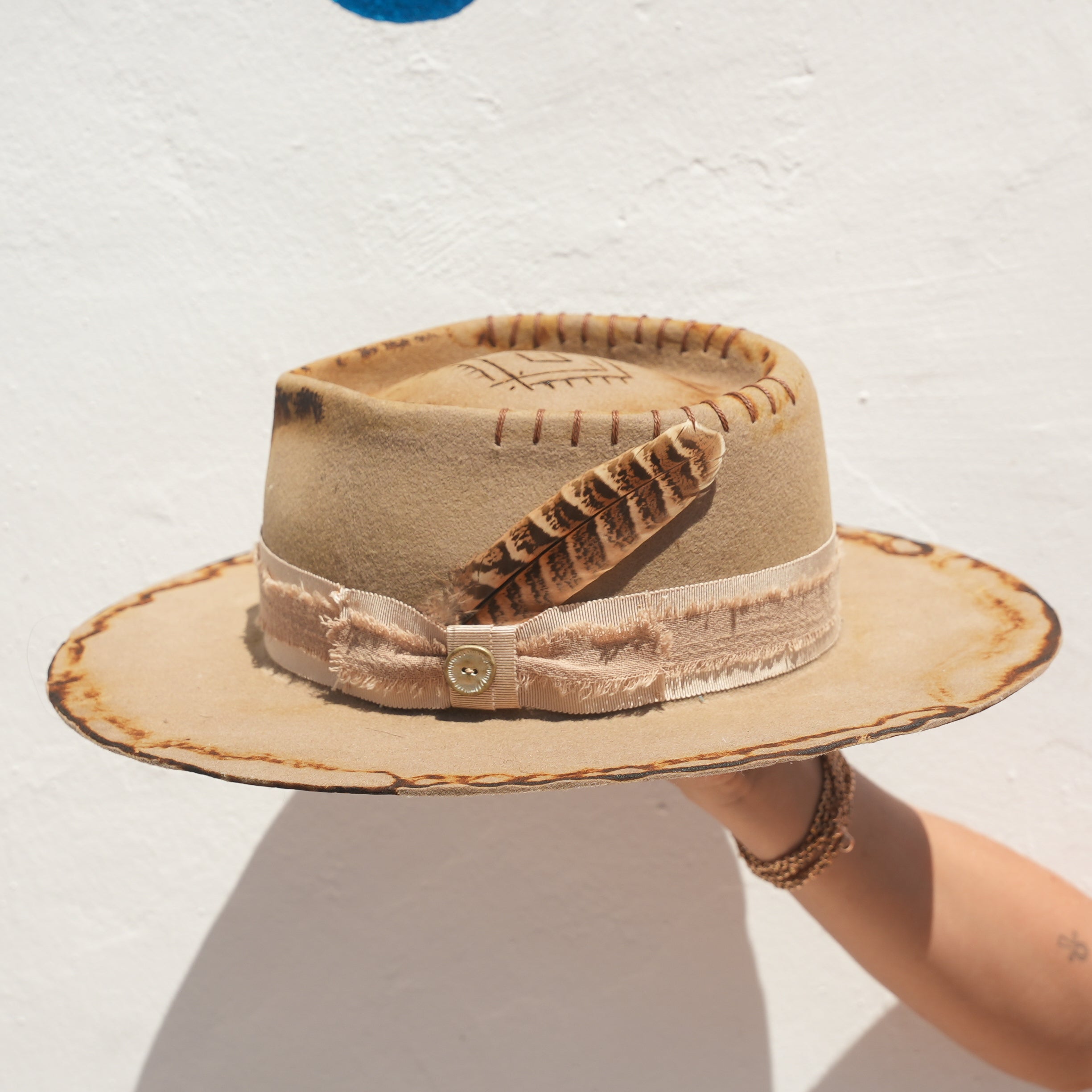 Beige Merino wool pinched fedora hat with engraved crown and feather detail — Satori Collection Earth Side