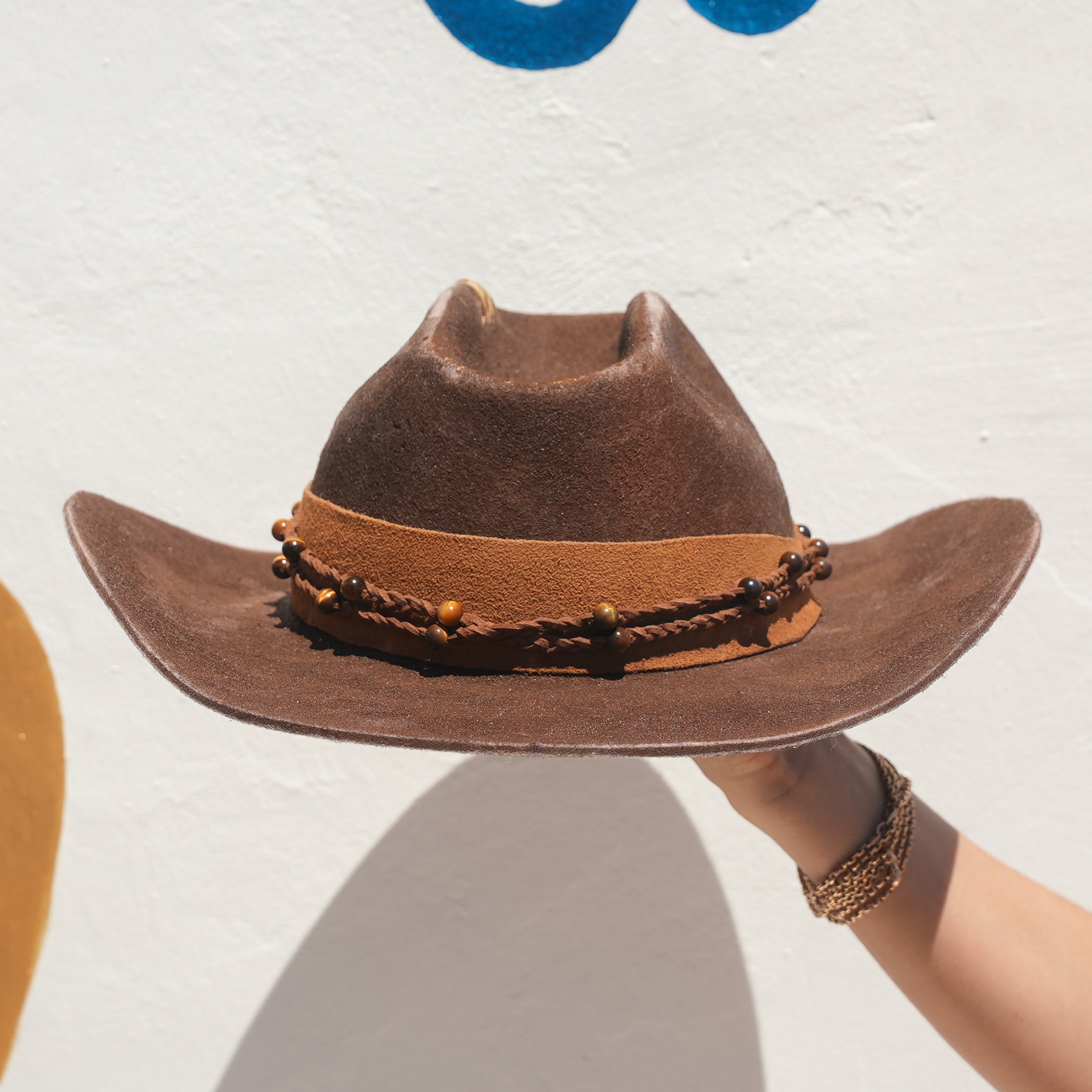 Cacao brown Merino wool cowboy hat with Tigers Eye belt worn at festival — Satori Collection Warrior